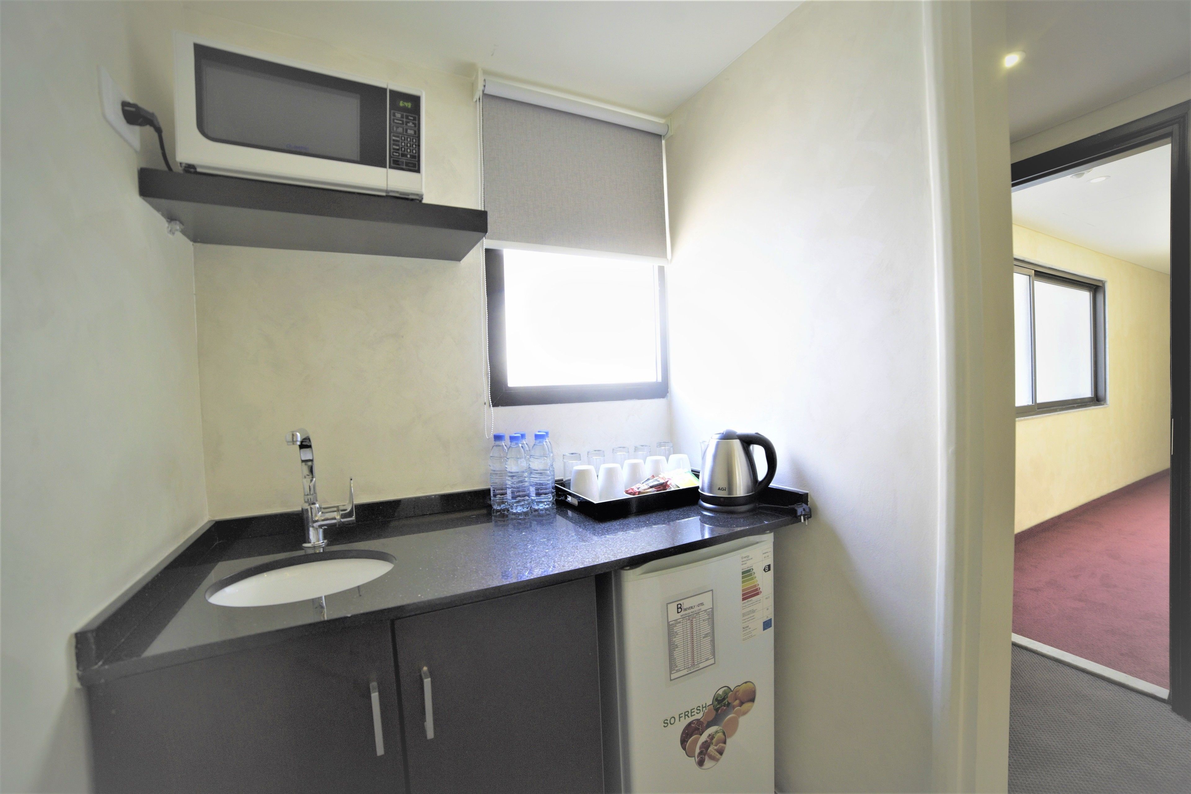 family suite, 2 bedrooms, city view | private kitchenette | fridge, microwave, coffee/tea maker, electric kettle