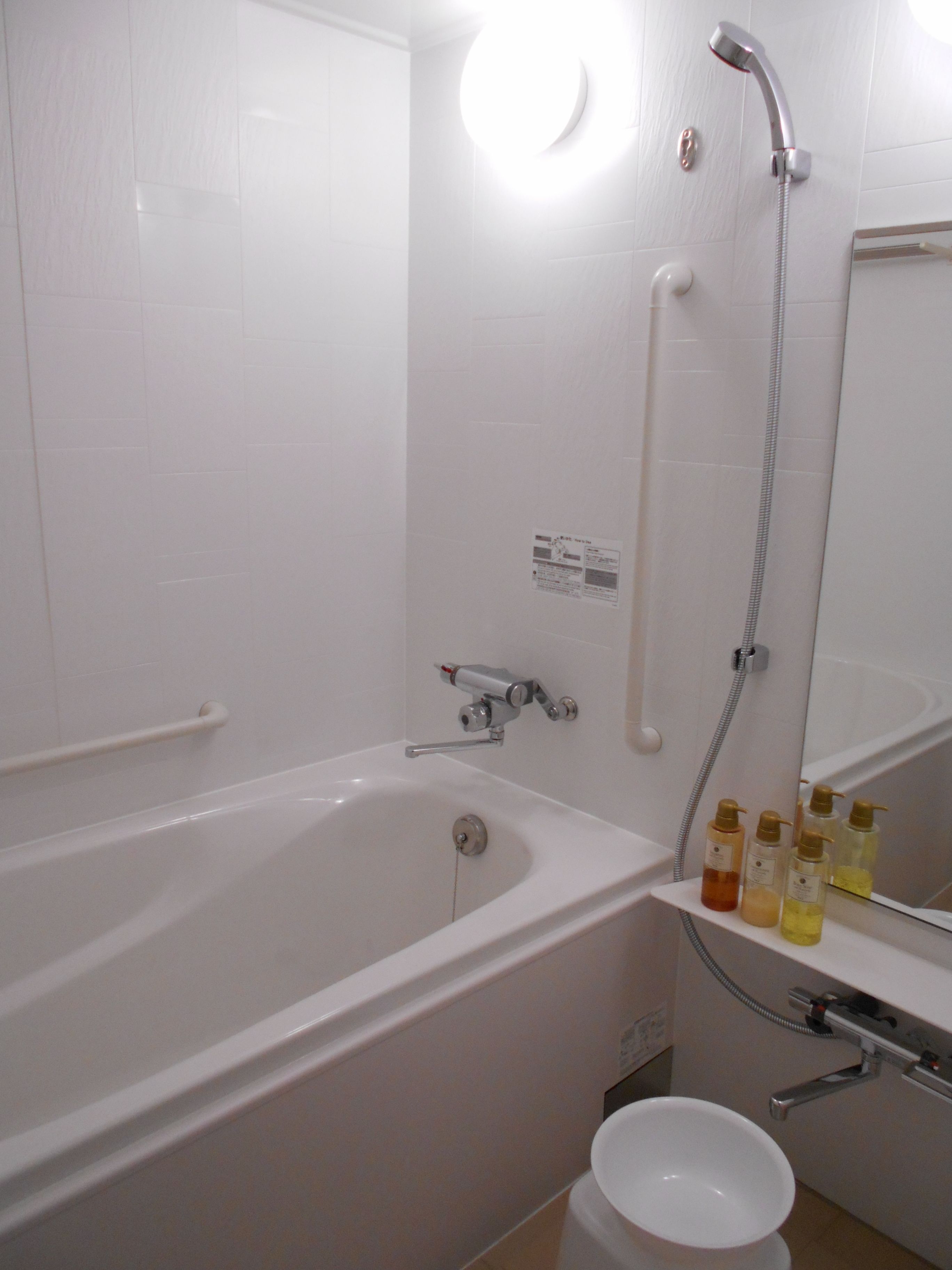 separate bathtub and shower, slippers, bidet, towels
