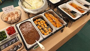 A buffet with various food options including fresh vegetables, eggs, and meat dishes. - Hotel Nishimura (Fuji)