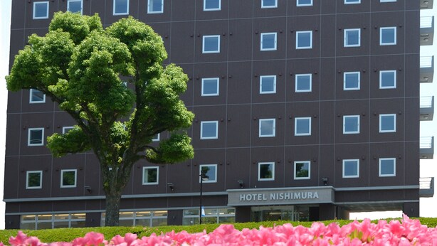 A modern hotel building with a grid of windows and a sign reading "HOTEL NISHIMURA". - Hotel Nishimura (Fuji)