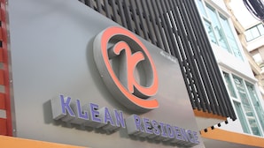 A sign for 'KLEAN RESIDENCE' with a stylized logo and the name in bold letters. - Klean Residence Hotel (Bangkok)