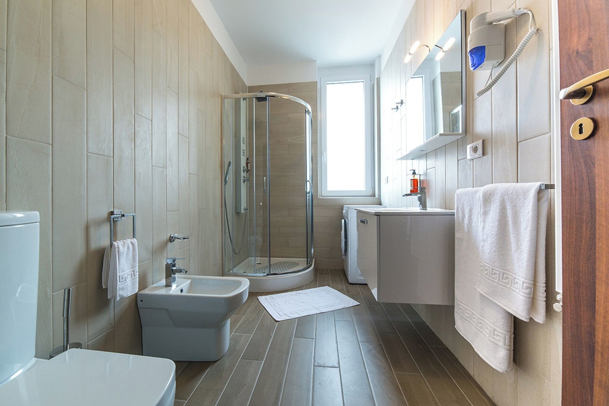 penthouse | bathroom | shower, slippers, towels