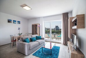 City Apartment, 1 Bedroom | Living area | 80-cm LCD TV with cable channels, TV