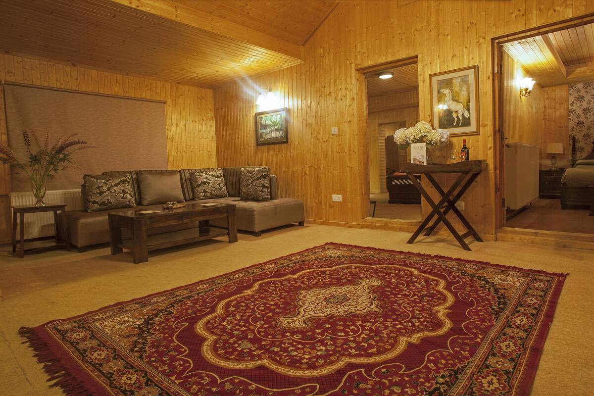 Family Cottage, 2 Bedrooms, Non Smoking, Hill View | Living area | Flat-screen TV, fireplace