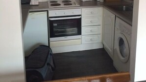 City Apartment, 1 Bedroom | Private kitchen | Coffee/tea maker, full-size fridge, microwave, oven