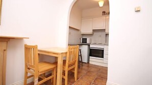 City Apartment, 1 Bedroom | Private kitchen | Coffee/tea maker, full-size fridge, microwave, oven