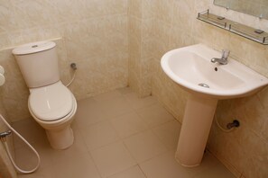 A bathroom with a toilet and a sink. - Silicon Bay Resort Cox's Bazar,BGD (Cox's Bazar)