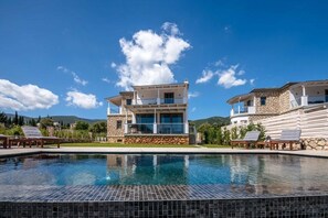 Seasonal outdoor pool, pool umbrellas, pool loungers