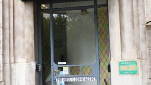 A hotel entrance with a sign reading "Hotel L. Da Vinci Hotel" and a smaller sign below stating "Albergo Hotel." - Hotel Leonardo da Vinci (Milan)