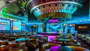 A theater with a stage, seating, and a sign for Eldorado Resorts. - Bally’s Shreveport Casino and Hotel (Shreveport)