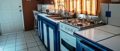 Family Apartment, 1 Bedroom, Patio, Ground Floor | Private kitchen | Full-size fridge, microwave, stovetop, electric kettle