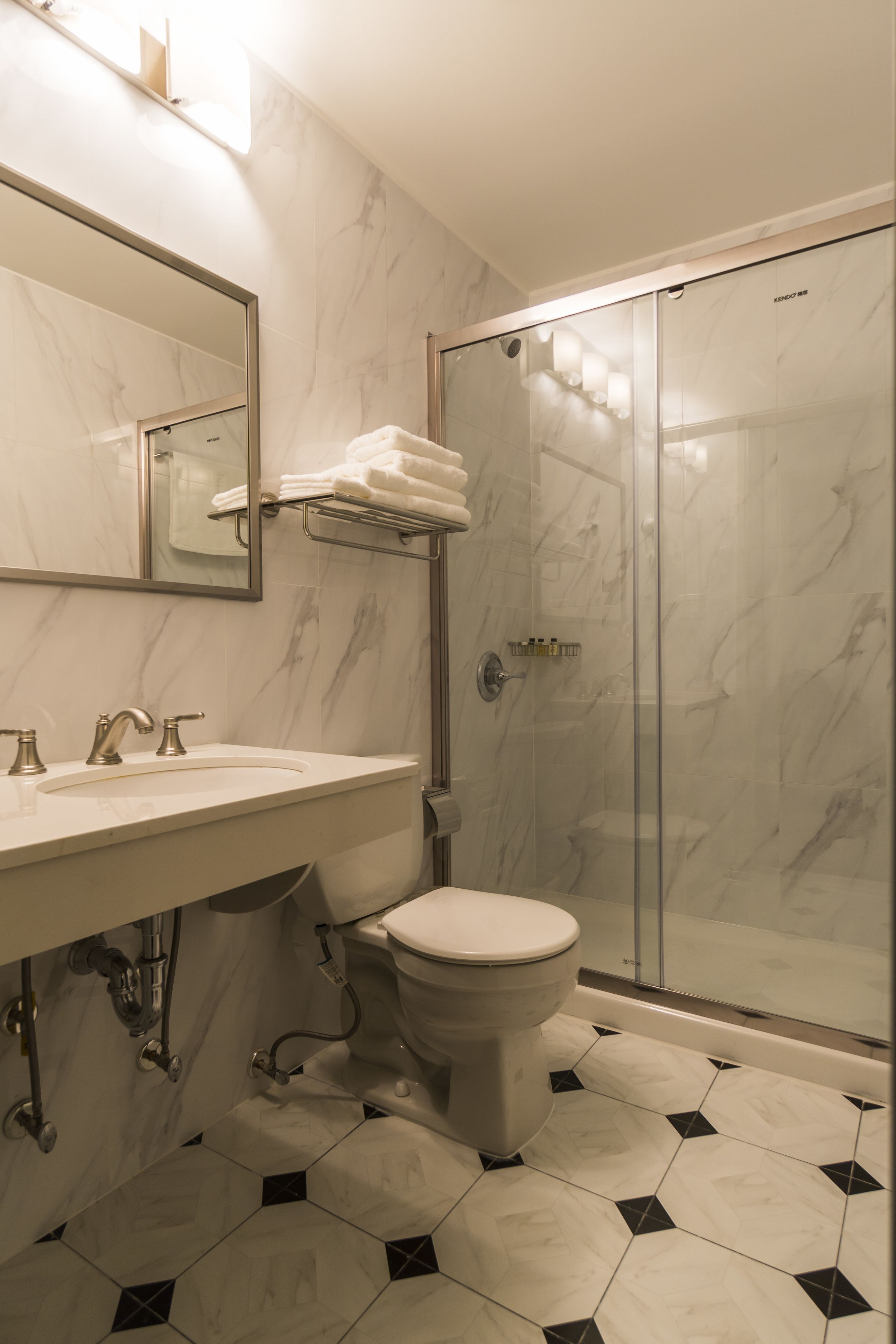 classic double room, 2 queen beds | bathroom | shower, rainfall showerhead, free toiletries, hair dryer