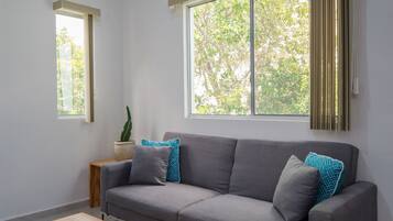 Comfort Condo, 2 Bedrooms | Living room | Flat-screen TV, ping pong