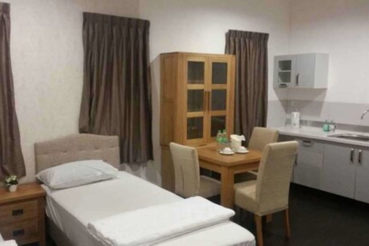 Minibar, desk, bed sheets