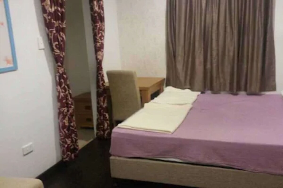 Minibar, desk, bed sheets