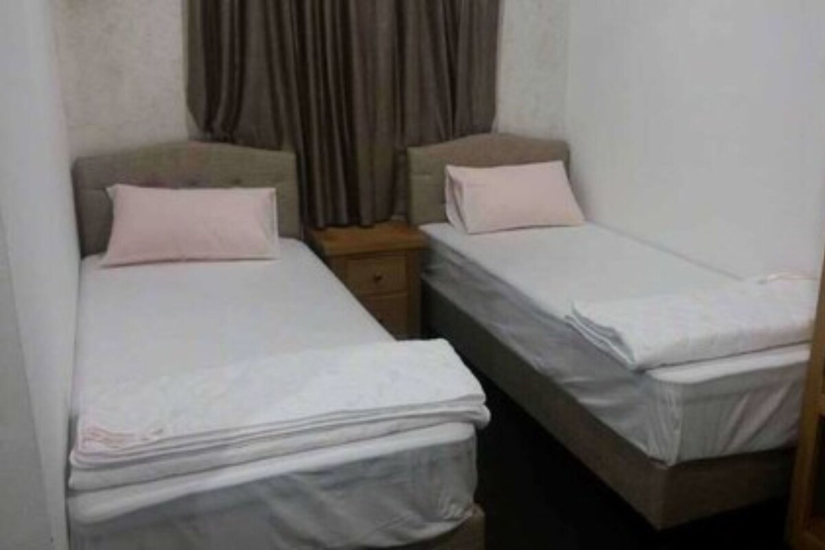 Minibar, desk, bed sheets