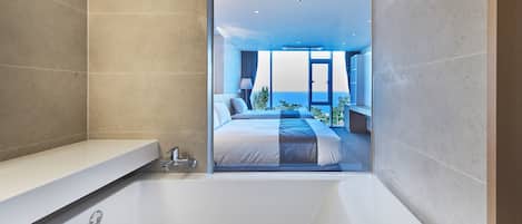 Deluxe Twin Ocean View | Bathroom | Eco-friendly toiletries, hair dryer, slippers, towels