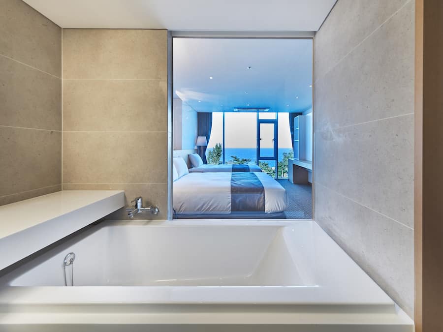 Deluxe Twin Ocean View | Bathroom | Eco-friendly toiletries, hair dryer, slippers, towels