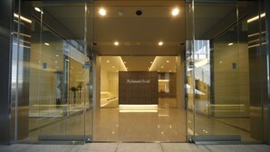 The entrance to Richmond Hotel with a modern design, glass doors, and a sign indicating the hotel's name. - Richmond Hotel Fukuyama Ekimae (Fukuyama)
