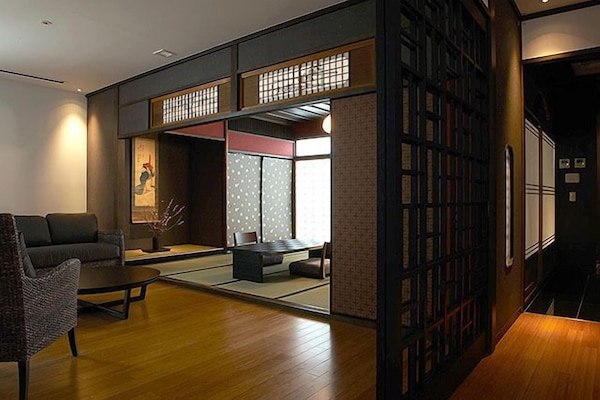 Executive Suite Room | Minibar, in-room safe, individually decorated, individually furnished