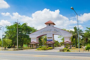 A large archway with the text "Goldenland Resort" at the top.