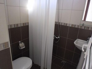 Shower, free toiletries, slippers, towels