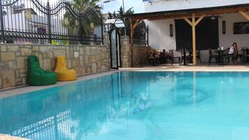 Outdoor pool, pool umbrellas, pool loungers