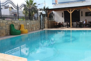 Outdoor pool, pool umbrellas, pool loungers