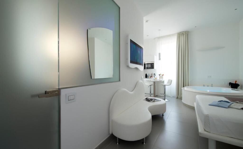 studio, jetted tub | living area | 43-inch smart tv with satellite channels