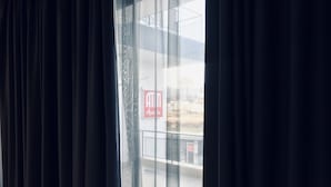 A view through a window with a sign reading "ATM Apartments." - ATM Aparts Sofia (Sofia)