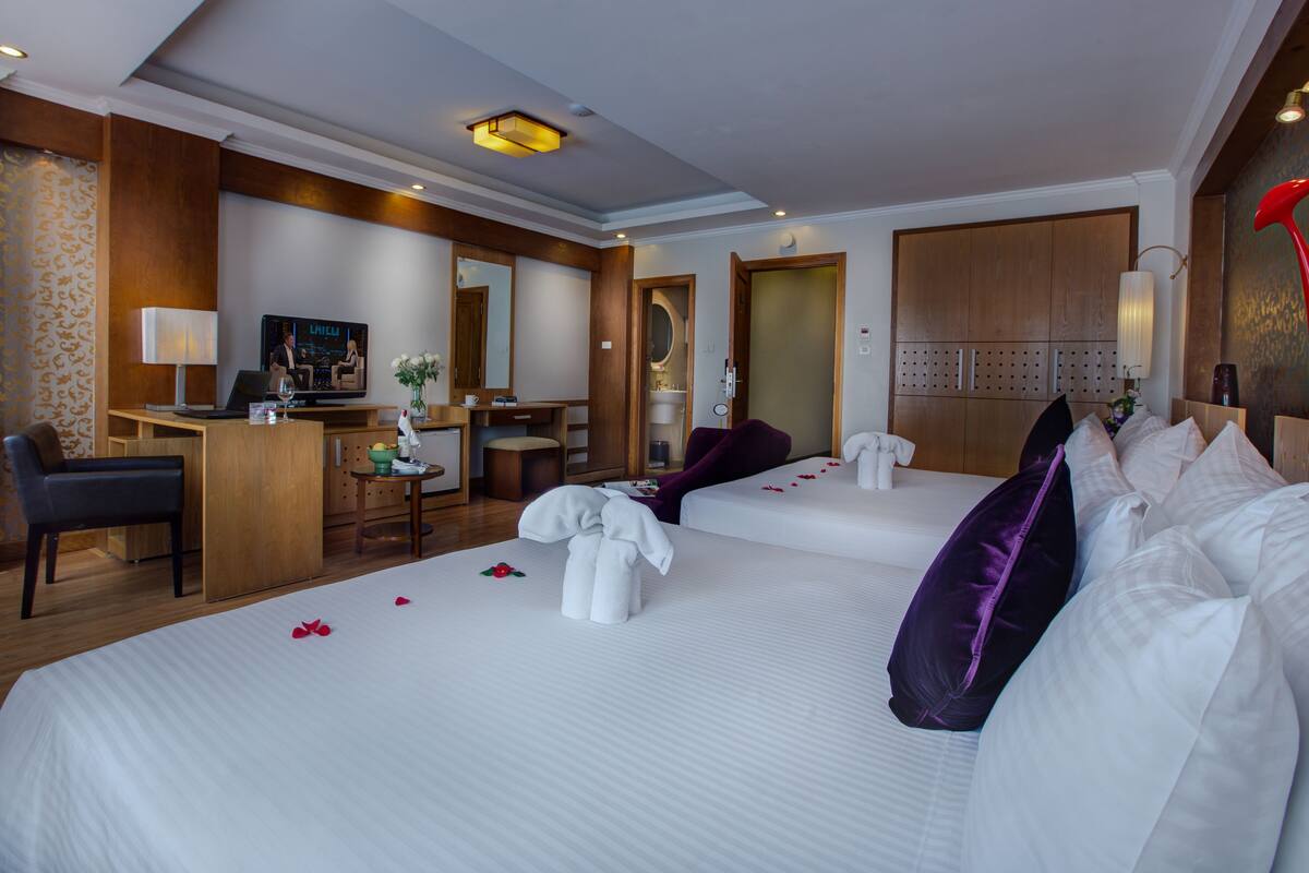 Family Suite, 2 Queen Beds, City View | Minibar, in-room safe, desk, blackout curtains