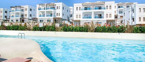 Outdoor pool, pool umbrellas, pool loungers