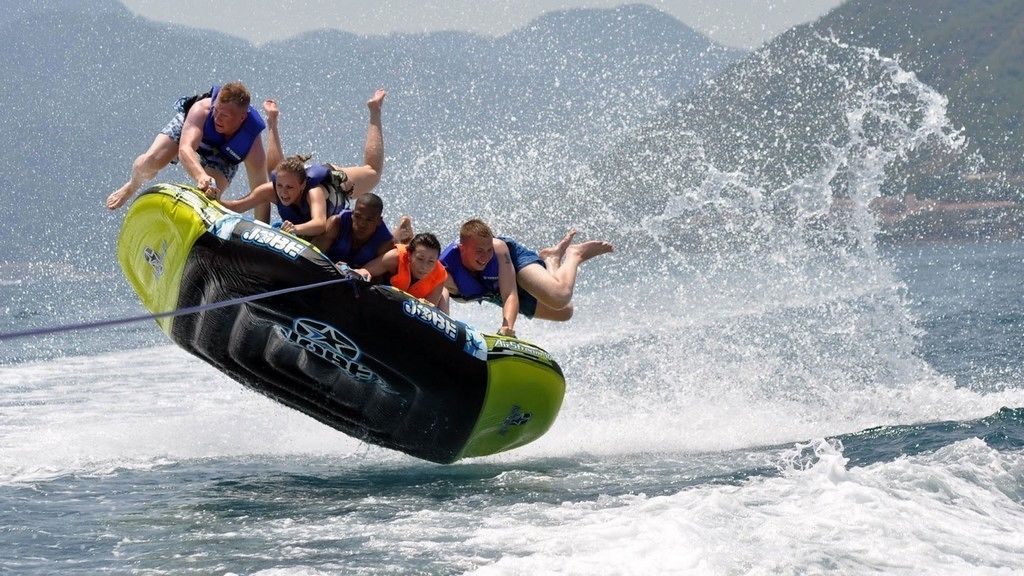 A water sport activity with participants on a jet ski.