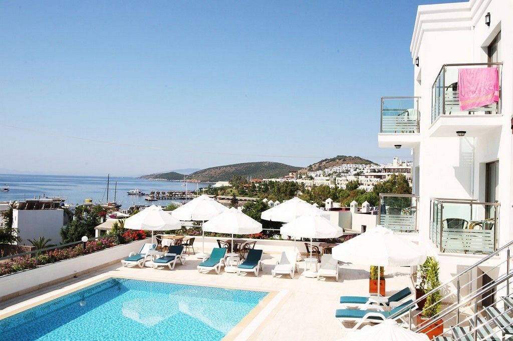 outdoor pool, pool umbrellas, pool loungers