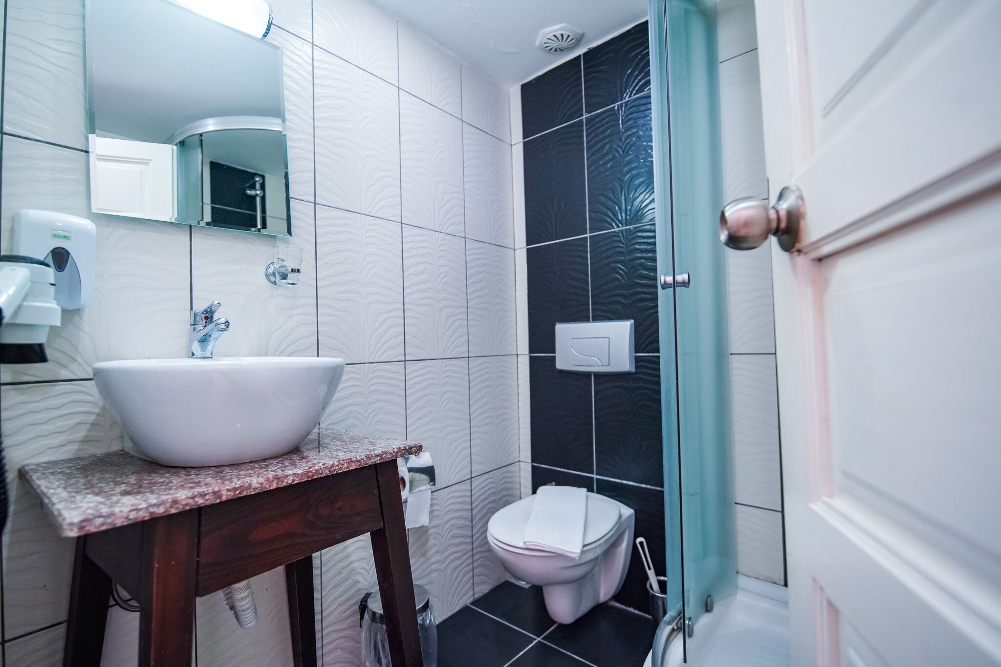 economy double room, hill view | bathroom | shower, free toiletries, hair dryer, slippers