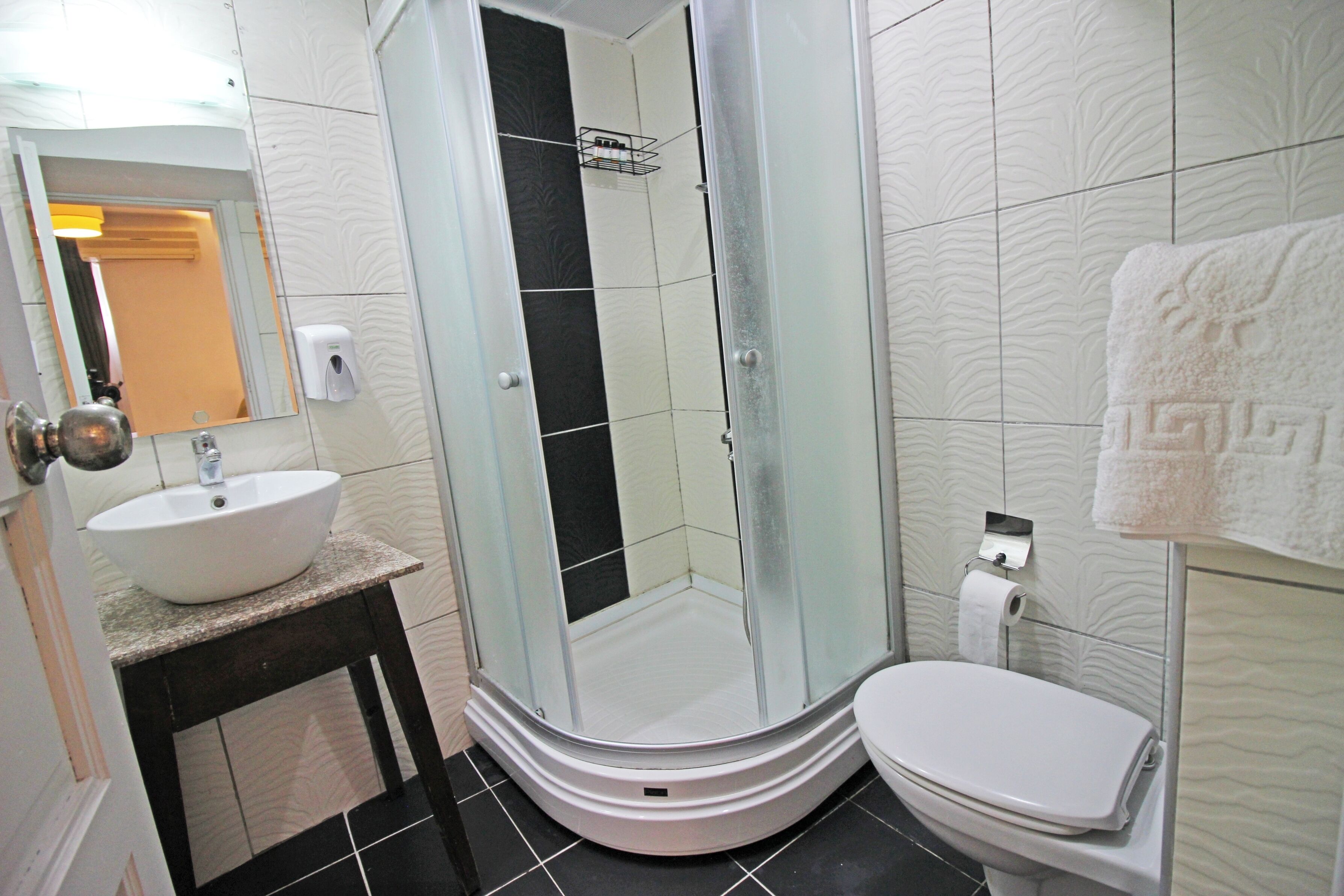 economy twin room (basement) | bathroom | shower, free toiletries, hair dryer, slippers