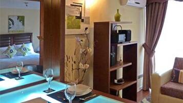 Standard Apartment, 1 Queen Bed | Private kitchen | Full-size fridge, microwave, stovetop, electric kettle