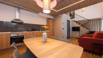 Superior Split Level Apartment | Living area | LED TV