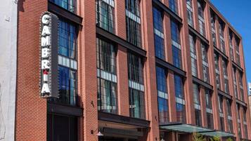 A red brick building with a sign that reads "CAMBRIA" and "ENTRY."