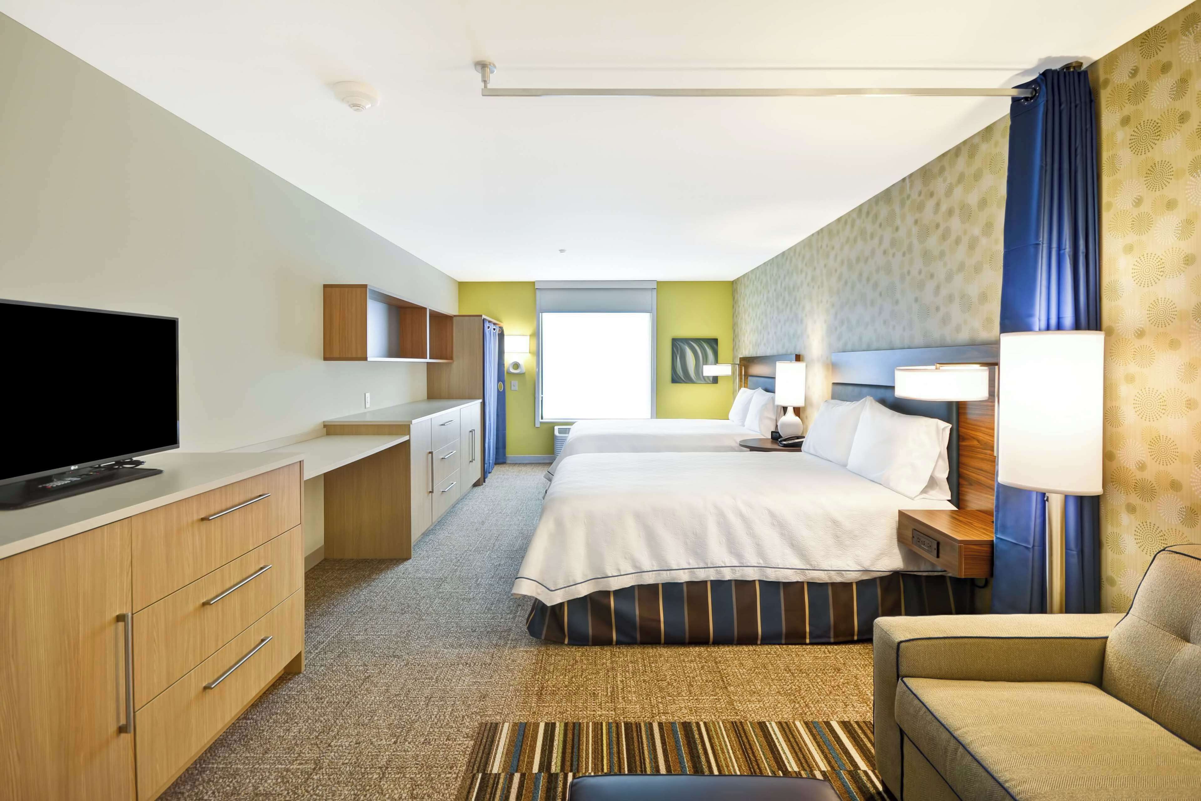 Desk, blackout drapes, iron/ironing board, free cribs/infant beds