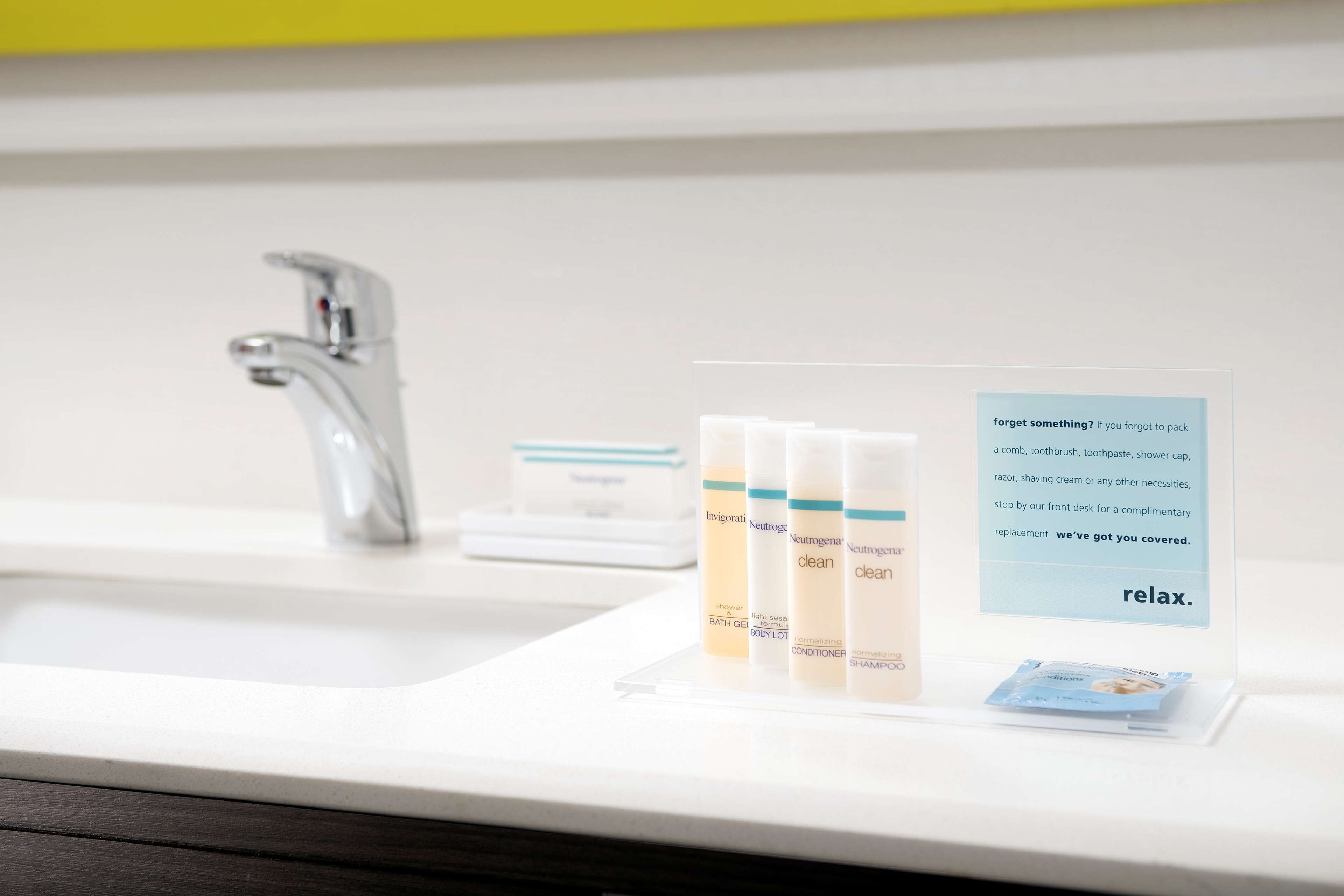 designer toiletries, hair dryer, towels, soap