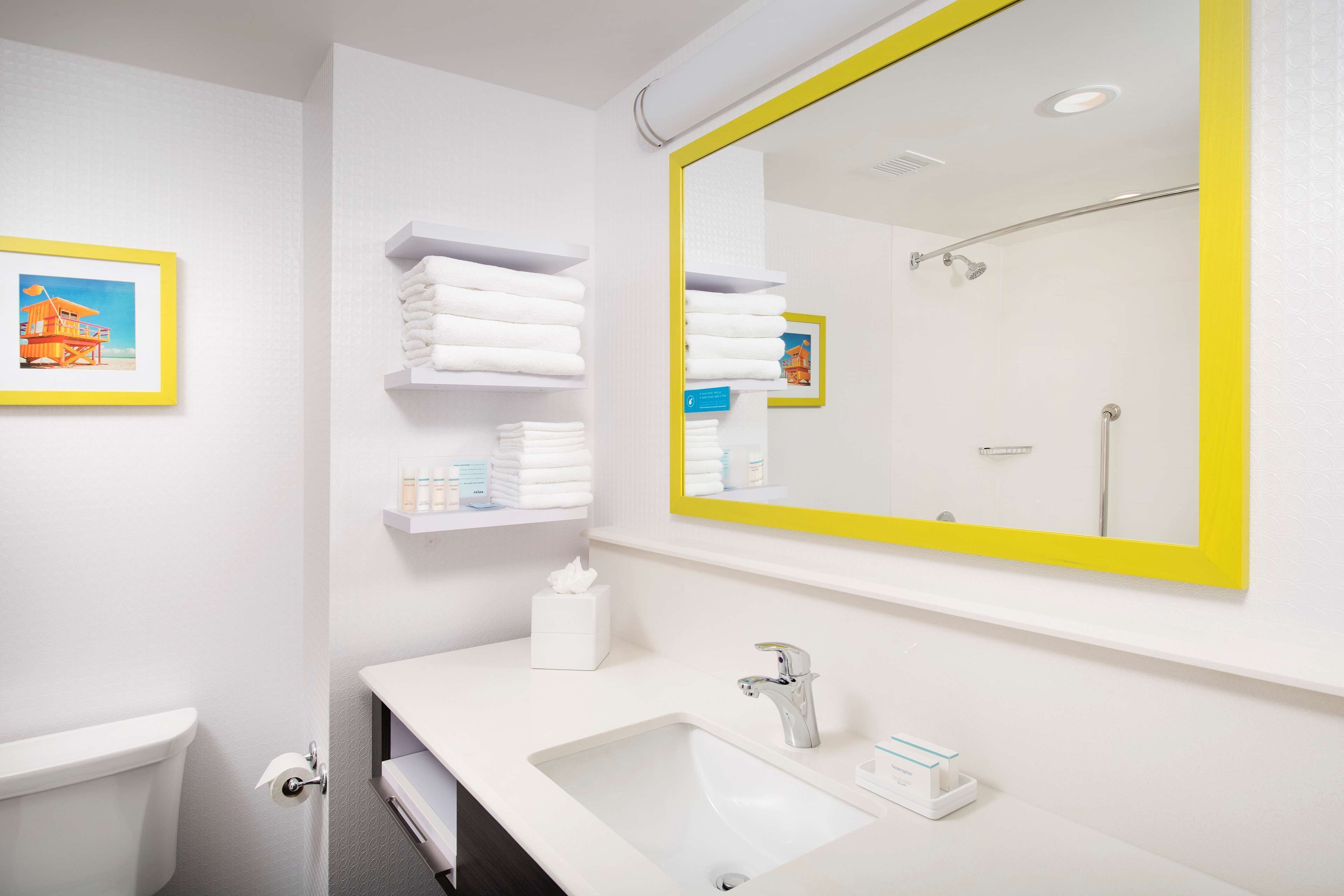 designer toiletries, hair dryer, towels, soap