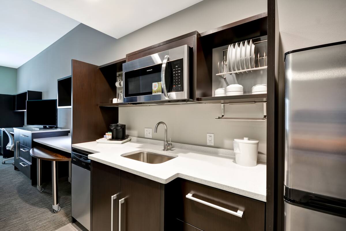 full-sized fridge, microwave, dishwasher, coffee/tea maker