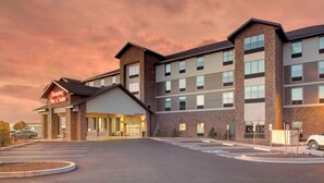 A hotel with a modern brick facade, multiple floors, and a parking lot. - Hampton Inn & Suites Flagstaff East (Flagstaff)
