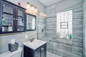 Combined shower/tub, hair dryer, towels, soap