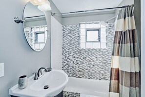 Combined shower/tub, hair dryer, towels, soap