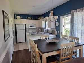 Enjoy meals in this kitchen with a central island, microwave, and stainless steel oven.