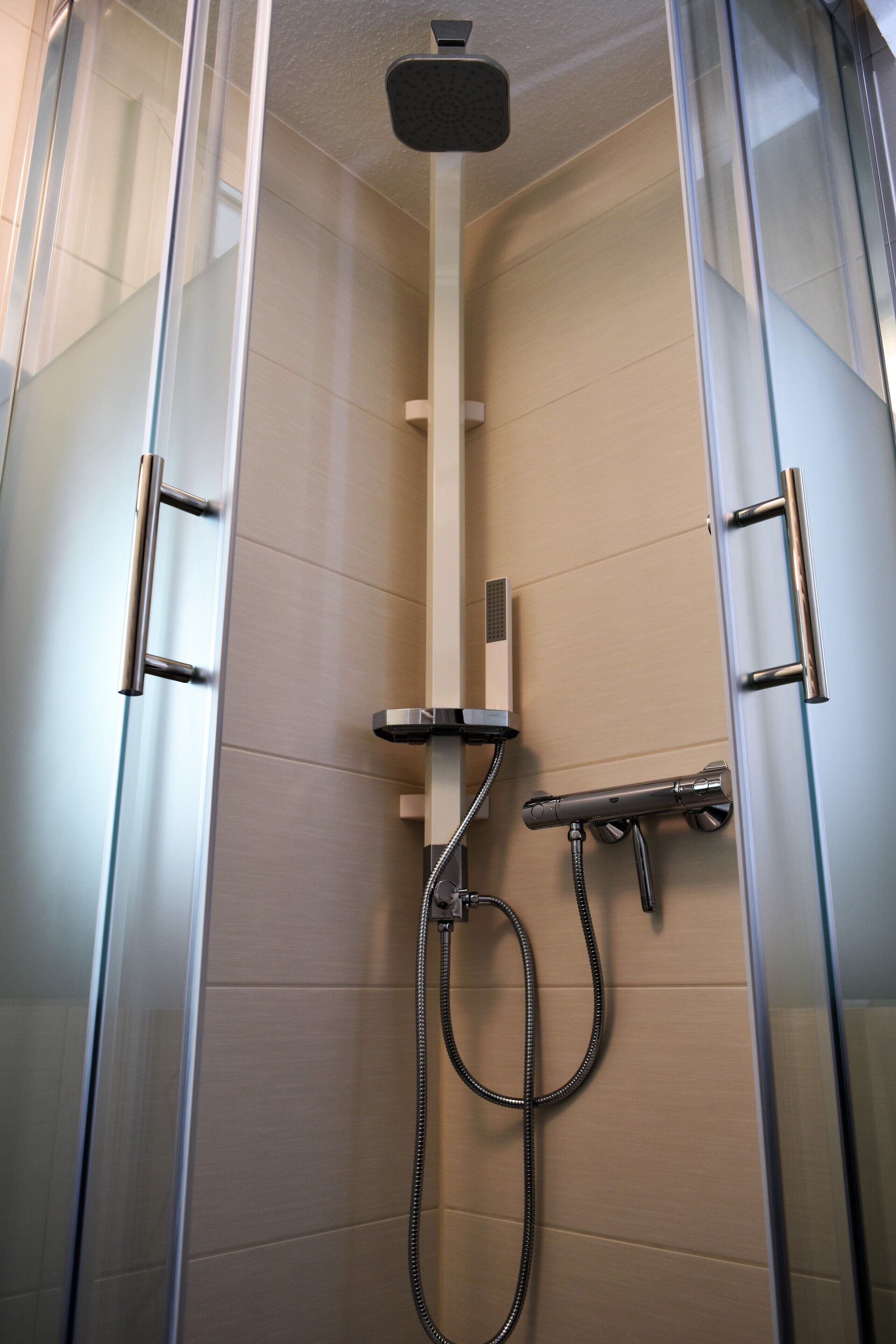 Shower, hair dryer, towels, toilet paper