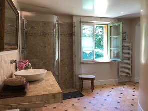 Combined shower/tub, hair dryer, towels, soap