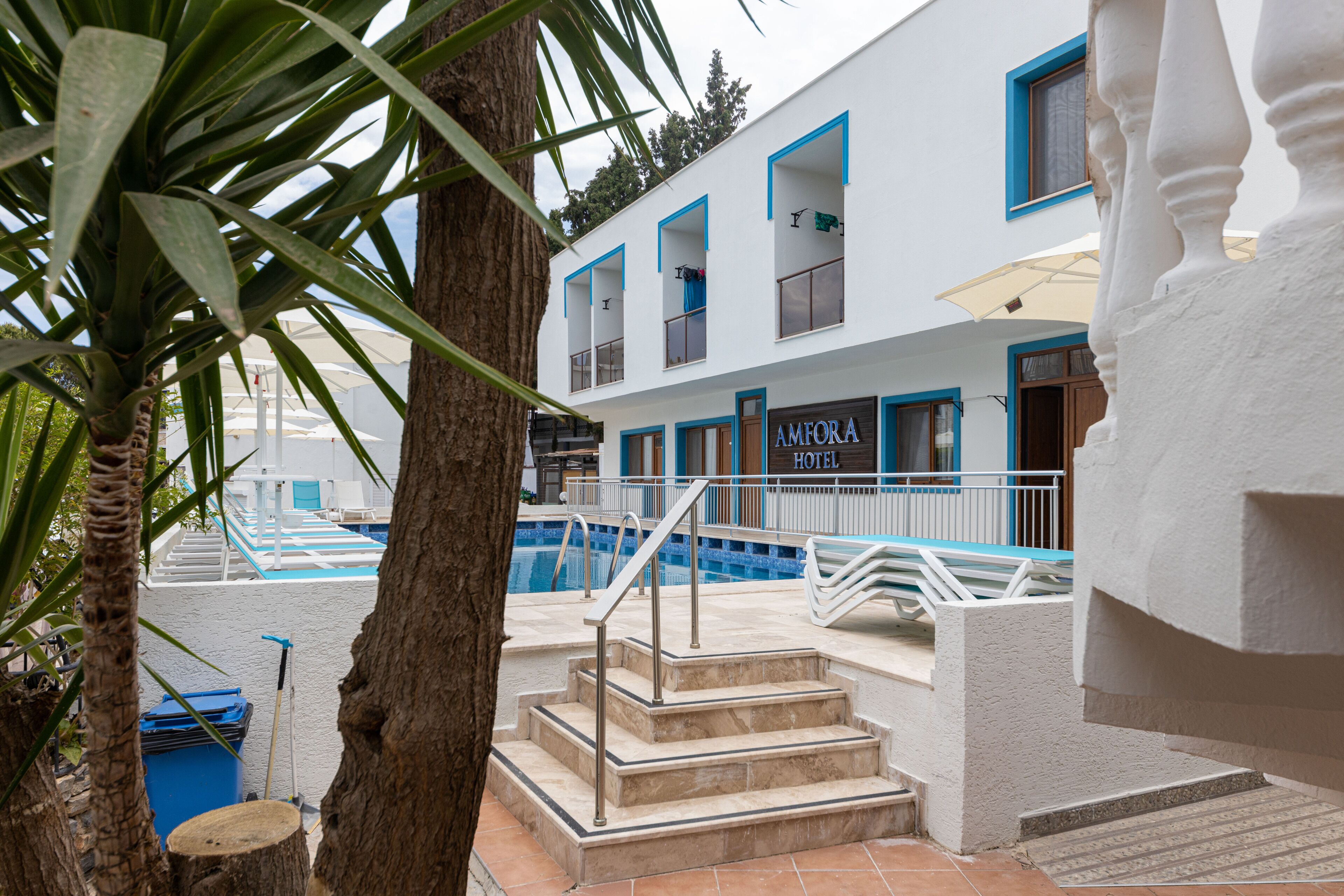 outdoor pool, pool umbrellas, pool loungers